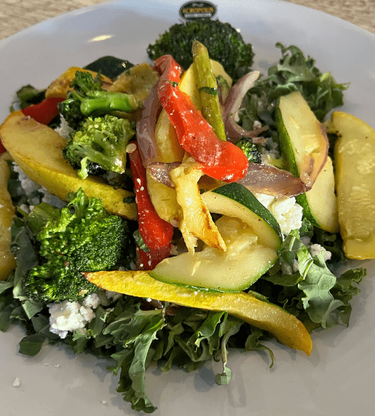 Acropolis Greek Taverna - Roasted Vegetable Salad: Roasted Seasonal Vegetables Served Over Fresh Kale with Feta Cheese Tossed with Acropolis Dressing.