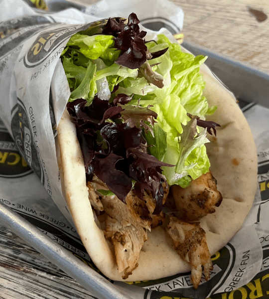 Acropolis Greek Taverna - Chicken Gyro Wrap: Seasoned Grilled Chicken Topped with Tomatoes, Onions, Lettuce and Tzatziki Sauce Wrapped in Two Pitas.