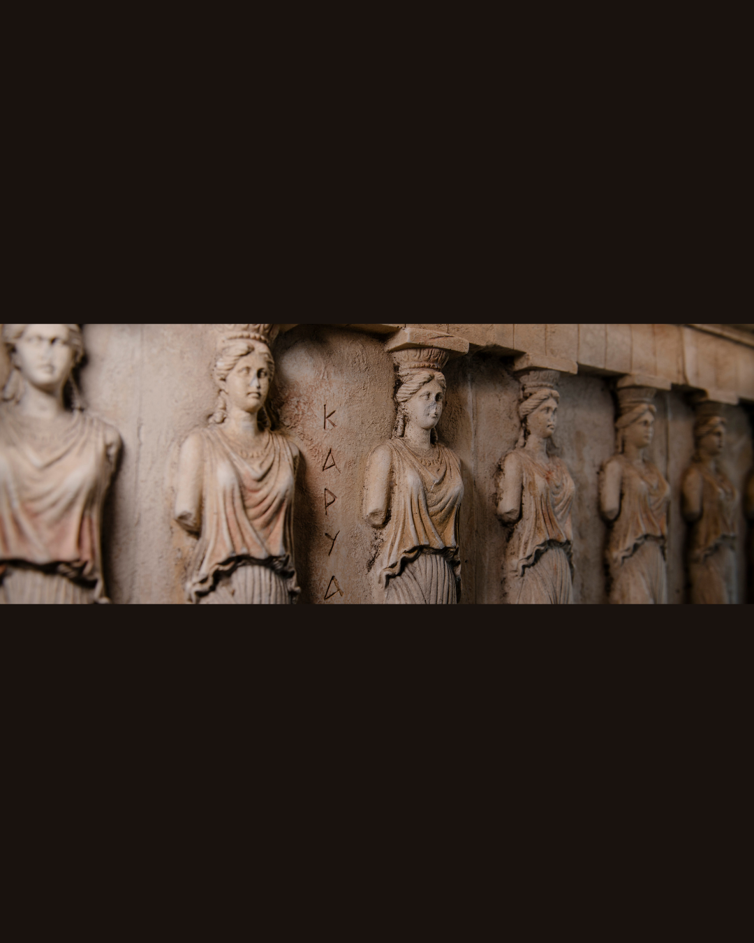 Caryatid relief sculpture at Acropolis Greek Taverna South Tampa on Kennedy Blvd