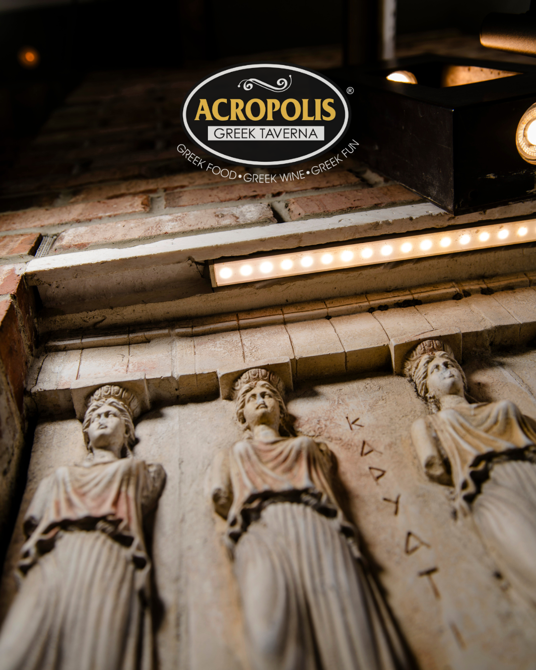 Acropolis Greek Taverna logo featuring Caryatid statues and Greek design elements.